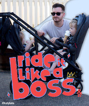 Mum and Dad looking at their toddlers in an inline® double pram  - voyager™ buggy - like a boss - @katytate - philandteds.com